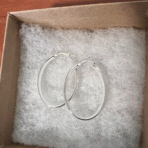 SOLD. Macy’s polished oval hoop earrings, sterling silver